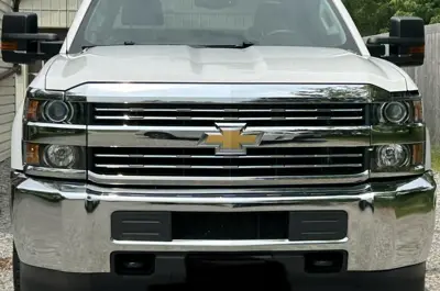 Polished front grill of a pickup truck