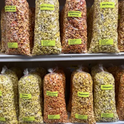 bags of flavoured popcorn lined up on a shelf