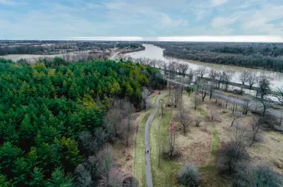 Lush park and trails next to the Grand River as seen from above