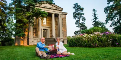 Couple having a picnic in front of Ruthven National Historic Site