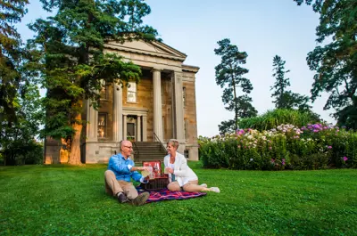 Couple having a picnic in front of Ruthven National Historic Site