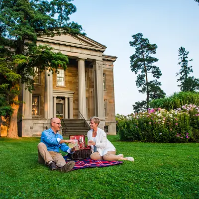 Couple having a picnic in front of Ruthven National Historic Site