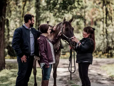 Couple With Horse Trainer And Horse